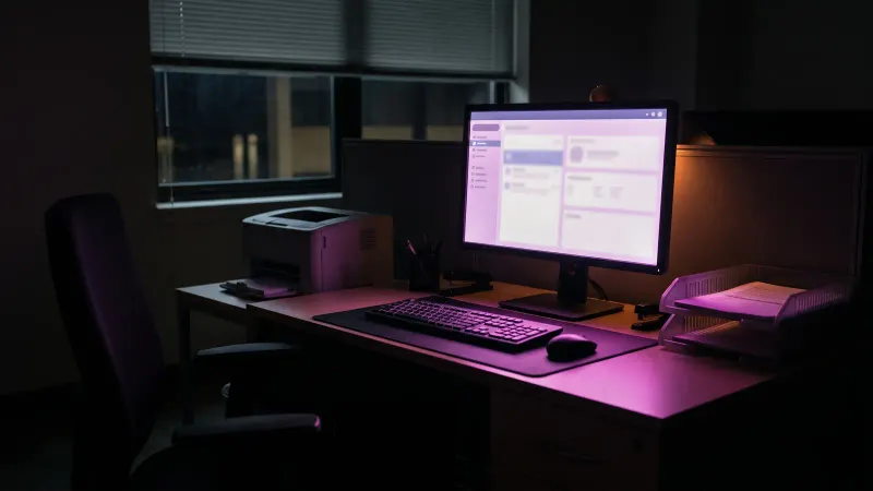 Tidy small office with standard software open on a monitor, showing when off the shelf software fits the job