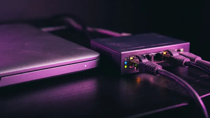 Macro of a laptop edge and network switch lights, the devices and network an MDR service should watch for a small business